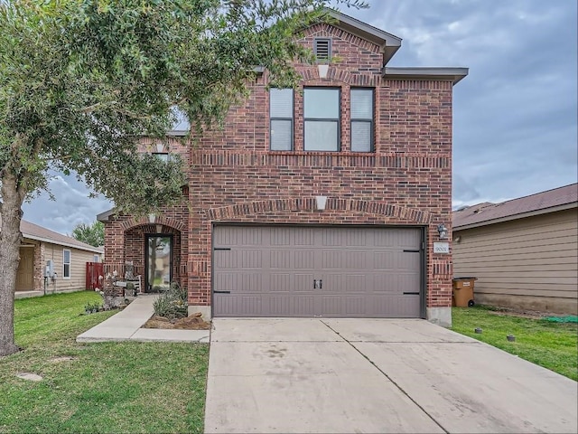 view of front property featuring a front yard and a garage