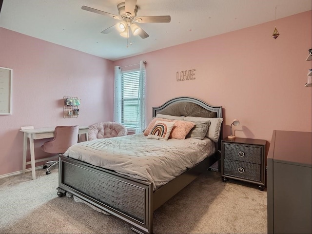 bedroom featuring light carpet and ceiling fan