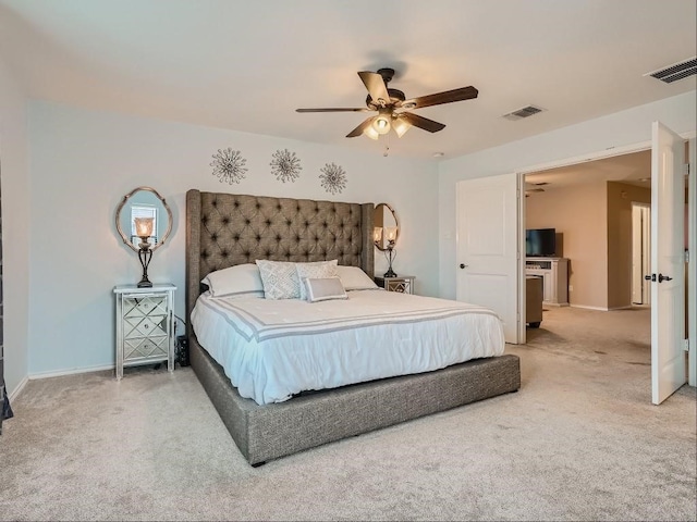 bedroom with ceiling fan and carpet