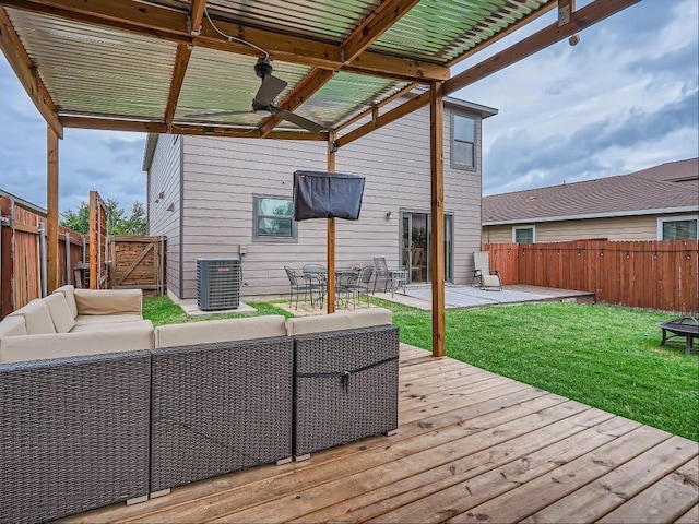 deck featuring central air condition unit, an outdoor living space, and a yard