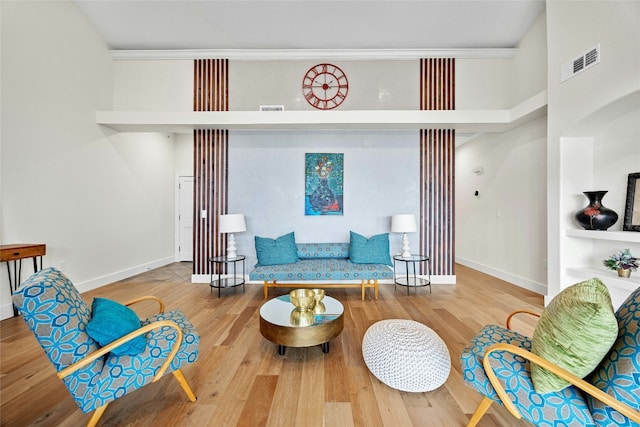 sitting room featuring wood-type flooring