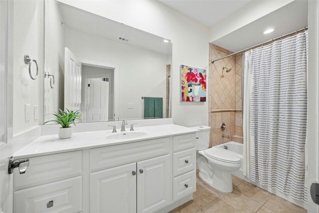 full bathroom featuring toilet, tile patterned flooring, shower / bath combination with curtain, and vanity