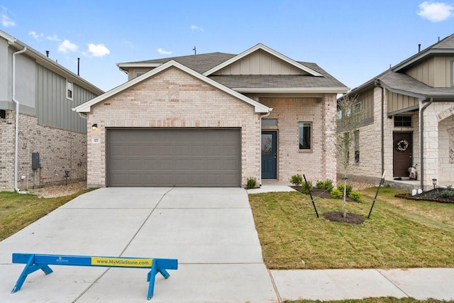 view of front of home featuring a garage and a front yard