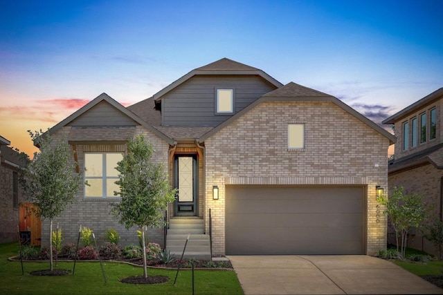 6000 Sean Paul Ln, Georgetown, TX 78628 - view of front of property with brick siding, concrete driveway, roof with shingles, and a lawn