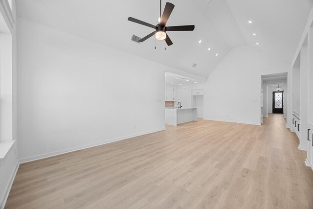 6000 Sean Paul Ln, Georgetown, TX 78628 - unfurnished living room featuring a ceiling fan, high vaulted ceiling, recessed lighting, and light wood finished floors