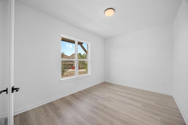 6000 Sean Paul Ln, Georgetown, TX 78628 - spare room featuring light wood-style flooring and baseboards