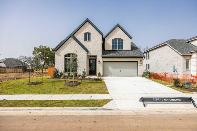 5612 Kyle Joseph Dr, Georgetown, TX 78628 - french country inspired facade with driveway, brick siding, a garage, and a shingled roof