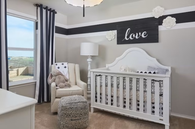 bedroom featuring a crib