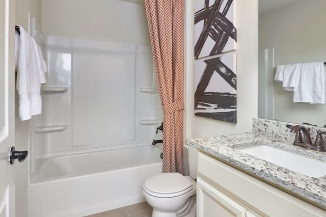 full bathroom featuring toilet, tile patterned floors, vanity, and shower / tub combo with curtain