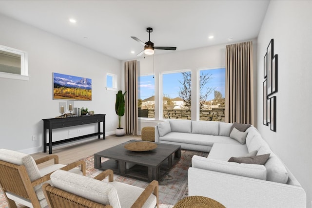 living area with recessed lighting, baseboards, wood finished floors, and ceiling fan