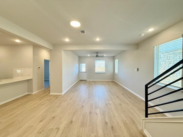 interior space featuring light hardwood / wood-style flooring and ceiling fan