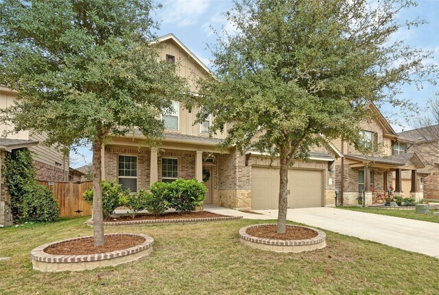 view of front of home featuring a porch, a garage, and a front yard