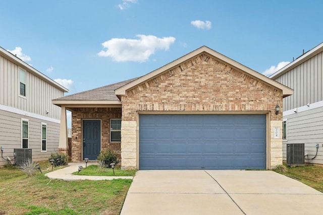 view of front of property featuring central AC and a garage