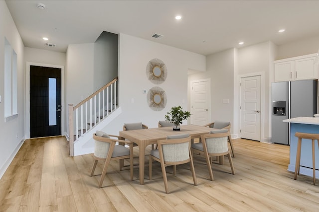 832 Venus Cir, Round Rock, TX 78664 - dining space with stairway, light wood-style floors, and recessed lighting