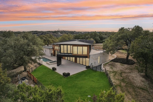 exterior space with a patio area and a yard