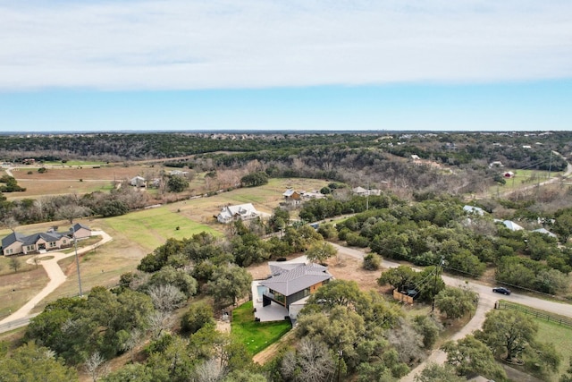 birds eye view of property with a rural view