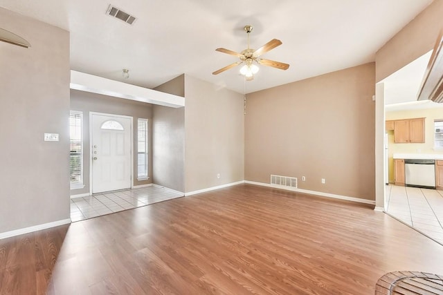 entryway with ceiling fan and light hardwood / wood-style floors