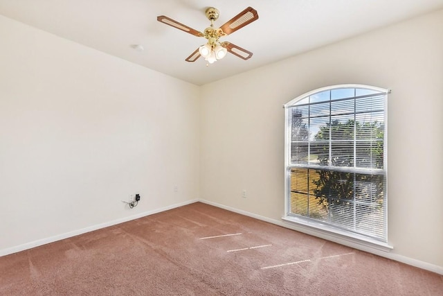 empty room with carpet and ceiling fan