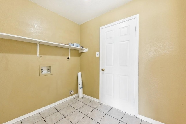 laundry room with electric dryer hookup, hookup for a washing machine, and light tile patterned floors