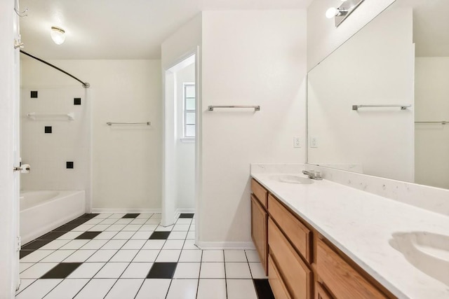 bathroom with tile patterned flooring, vanity, and  shower combination