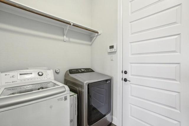 washroom featuring washing machine and dryer