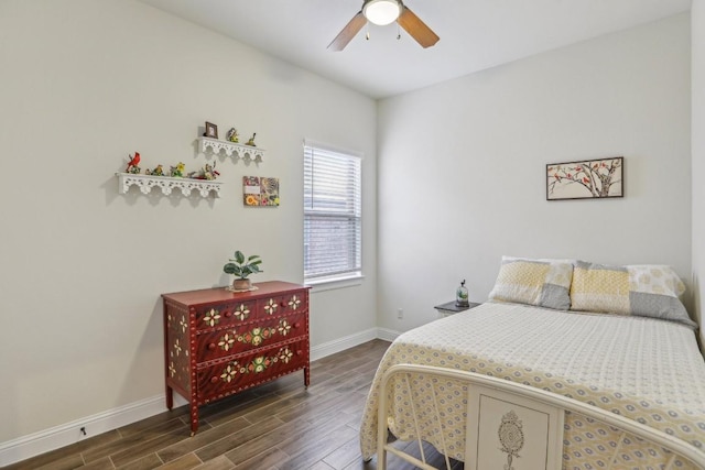 bedroom with ceiling fan and dark wood-type flooring