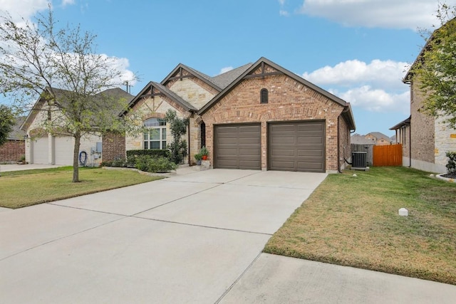 view of front of property featuring a front lawn and a garage