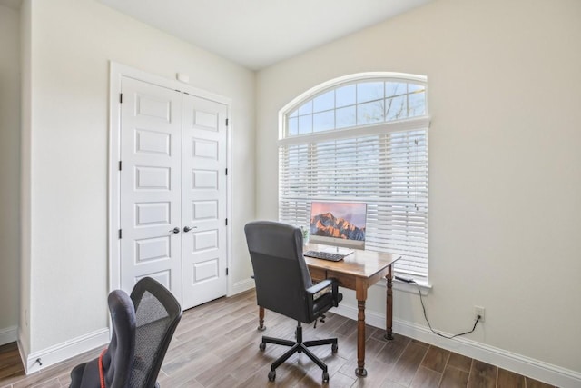 office space with hardwood / wood-style flooring and plenty of natural light