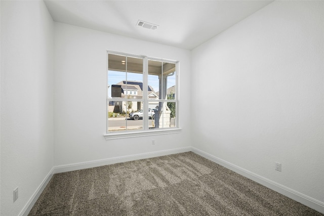 unfurnished room featuring carpet flooring