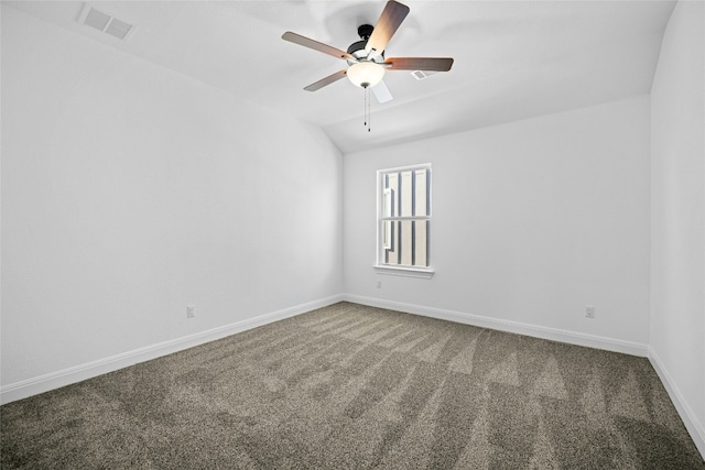 spare room featuring ceiling fan, carpet floors, and lofted ceiling