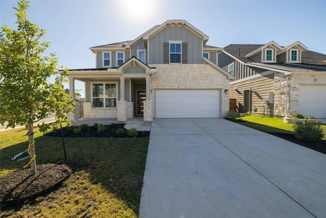 craftsman-style home with a front yard and a garage