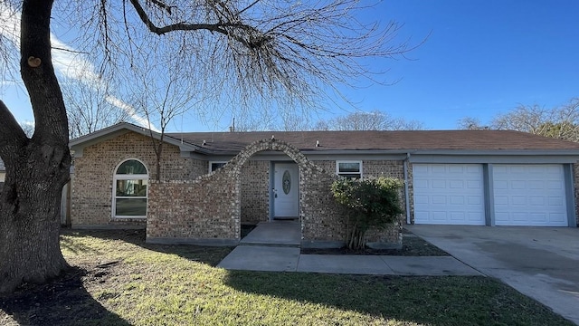 ranch-style home featuring a garage