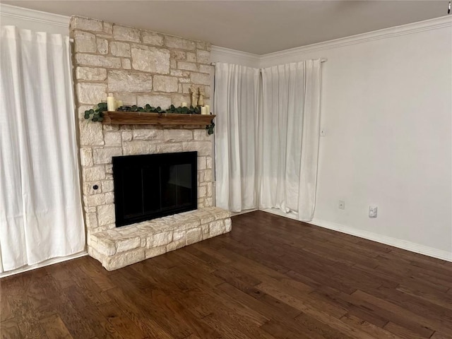 unfurnished living room with dark hardwood / wood-style flooring, ornamental molding, and a fireplace