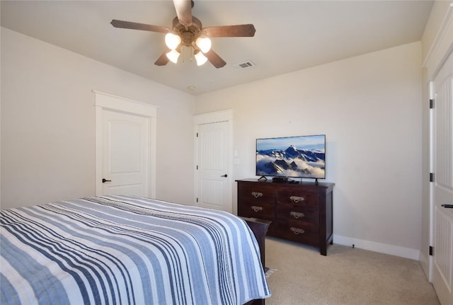 bedroom with light colored carpet and ceiling fan