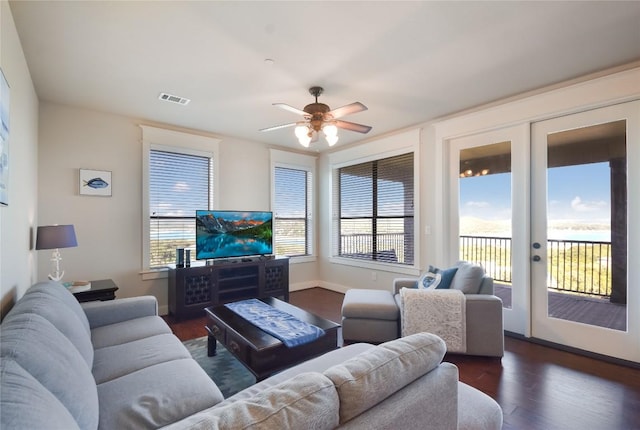 living room with ceiling fan, dark wood-type flooring, and french doors