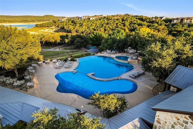 view of pool with an in ground hot tub and a patio