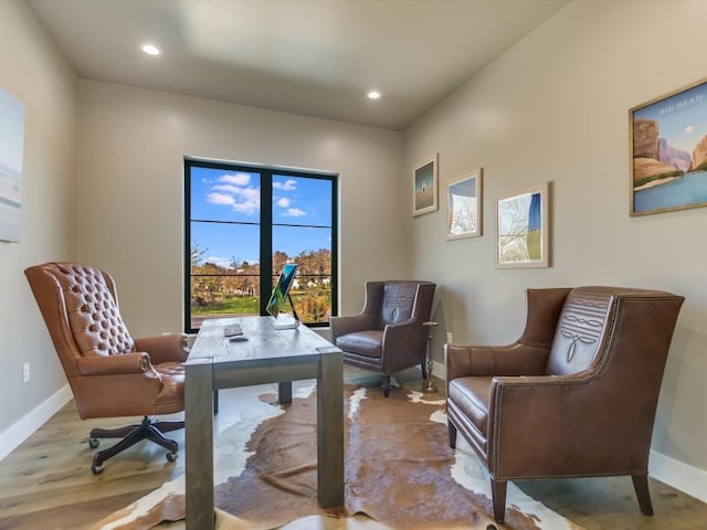 office space with light hardwood / wood-style floors