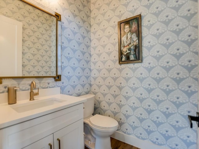 bathroom featuring hardwood / wood-style floors, vanity, and toilet