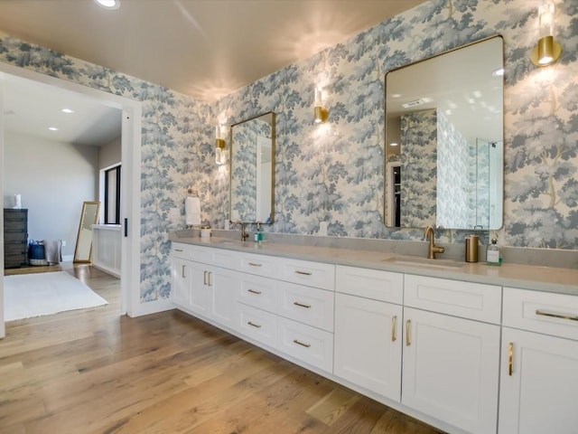 bathroom with wood-type flooring and vanity