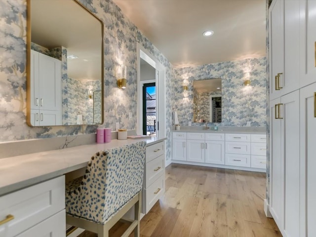 bathroom with wood-type flooring and vanity