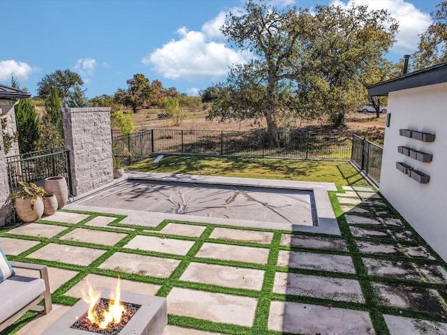 view of yard with a patio area and a fire pit