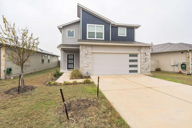 view of front of house with a garage and a front yard