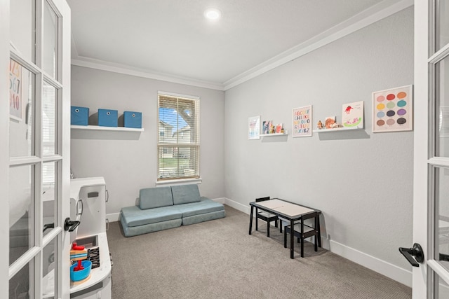 recreation room with baseboards, carpet floors, and ornamental molding