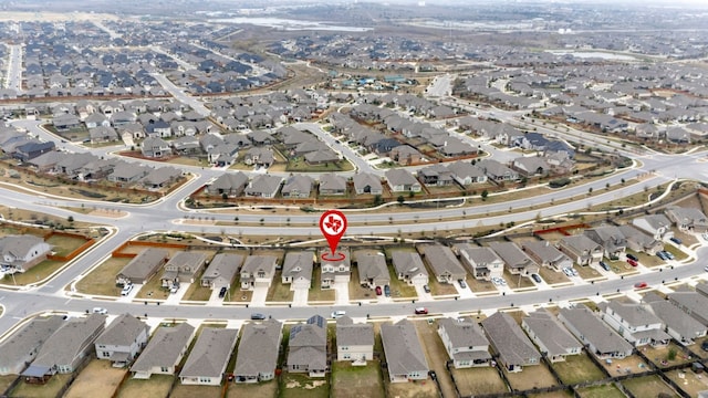 birds eye view of property with a residential view