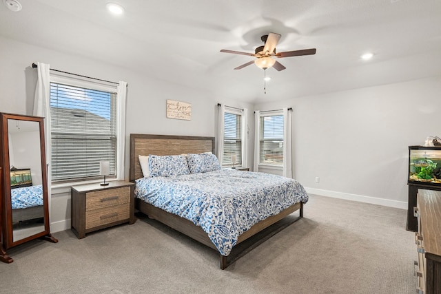 bedroom with recessed lighting, light colored carpet, a ceiling fan, and baseboards