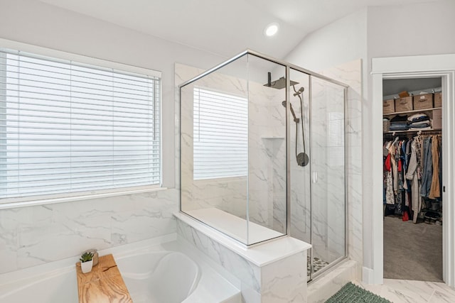 bathroom featuring a marble finish shower, recessed lighting, a spacious closet, and a bath