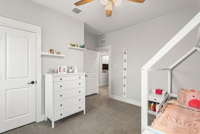 carpeted bedroom featuring visible vents, baseboards, and a ceiling fan