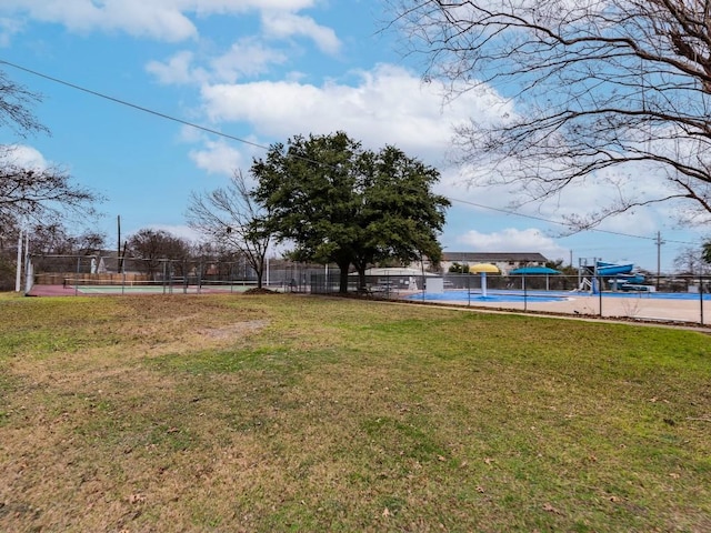 view of yard with tennis court