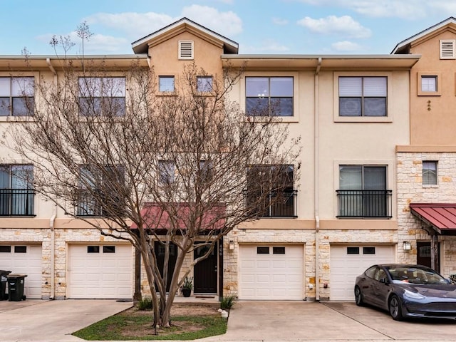 multi unit property featuring a garage