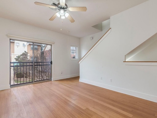 unfurnished room featuring ceiling fan and light wood-type flooring